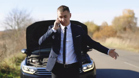 Unhappy Businessman Speak on Phone Near the Broken Electric Car Help Repair Stress Problem