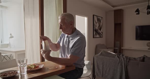 Elderly Man Eating Delivery Food alt