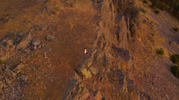 Hiker walking to viewpoint on mountain, Puerto de la Puebla, Spain alt