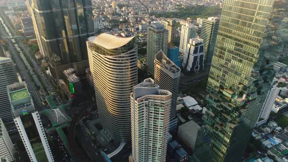 4k Aerial city view of Bangkok dowtnown, Flying over Bangkok, Thailand. alt