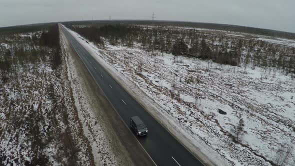 Car Driving on the Route in Winter alt