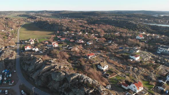 Scandinavian Remote Coastal Village in Cliff Landscape Pullback Aerial