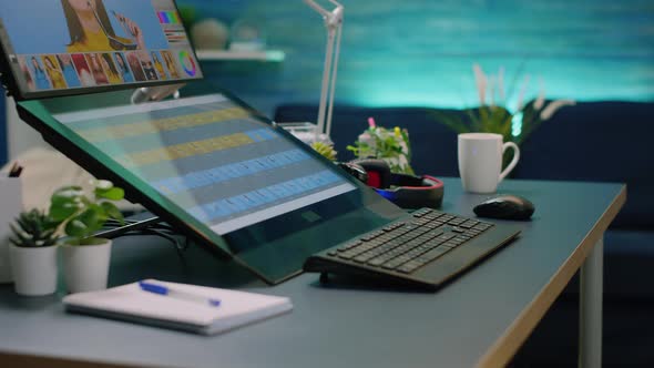 Close Up of Desk with Retouching Software on Computer alt