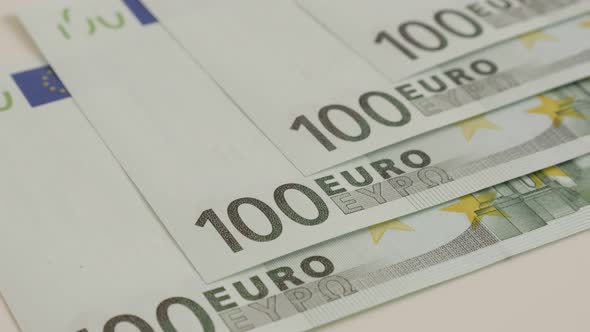 Green 100 paper EU banknotes slow tilt 4K 2160p 30fps UltraHD  footage - Euro money  and business co alt