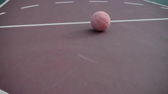 Basketball Seen on Free Throw Line of Court