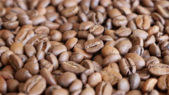 Dolly movements near coffee high quality beans background 4K 2160p 30fps UltraHD video - Arabica cof alt