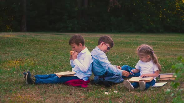 Student Eats Snack and Brother Helps Young Lady Writing alt