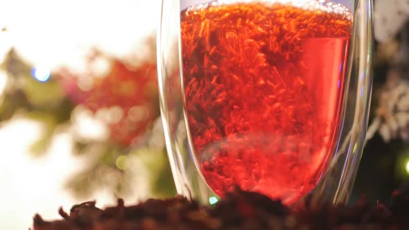 The Hibiscus Drink Is Poured Into a Glass Made of Glass with Double Walls