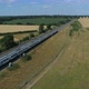 Fast Commuter Train Speeding Through the Countryside During Summer - VideoHive Item for Sale