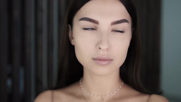 Portrait of Beautiful Young Well-groomed Caucasian Female Model with Blue Eyes alt