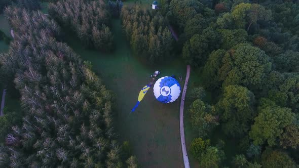 Pilots Raising Envelope of Hot Air Balloon, Basket on Ground, Preparation alt