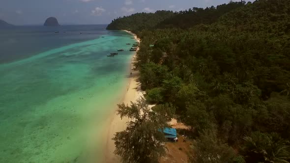 Aerial view of two traditional long tail boat moored in Chao Mai National Park in Thailand. alt