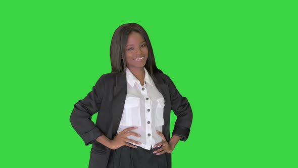Pretty African American Business Woman Smiling on a Green Screen, Chroma Key alt