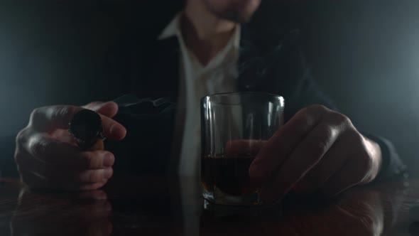 Stressed Businessman. Сigar and Alcohol in Hand Close Up