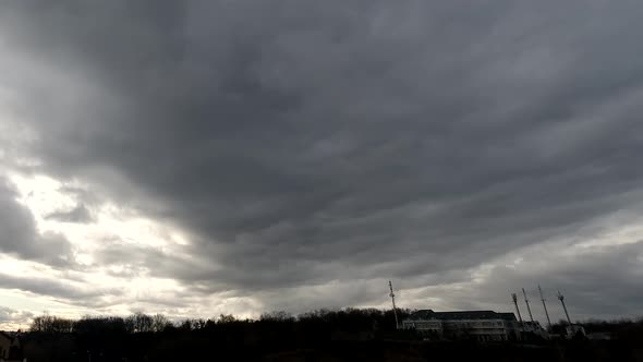 Time lapse: tremendous stormy clouds are moving toward camera view.