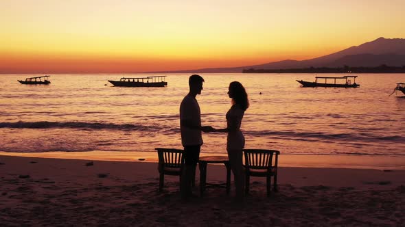 Guy and girl posing on marine coastline beach holiday by transparent ocean with white sand backgroun alt