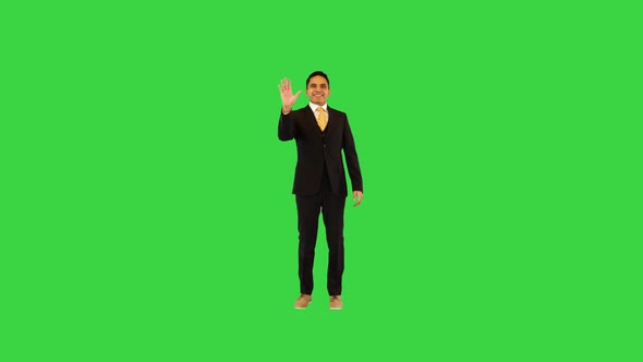 Happy Hispanic Businessman Walk Waving Hand Greeting or Welcoming Colleagues Coworkers with Smile on
