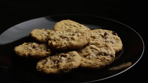 Cinematic, Rotating Shot of Cookies on a Plate  alt