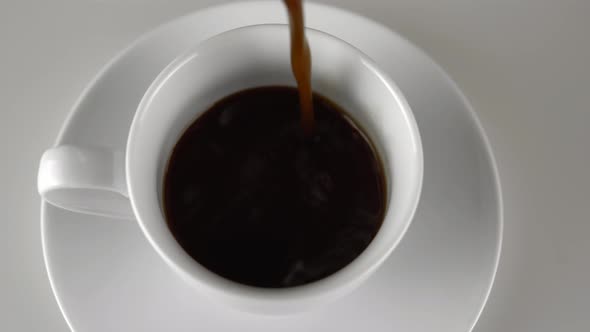 Pouring Coffee in White Cup Espresso Close Up