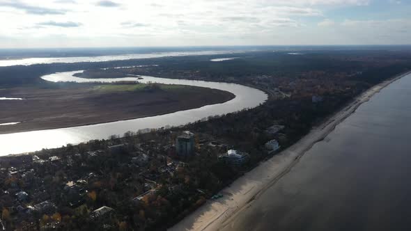 Aerial  Drone footage of Jurmala beach Latvia with river Lielupe in the background