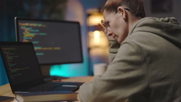 Woman Using Computers for Coding