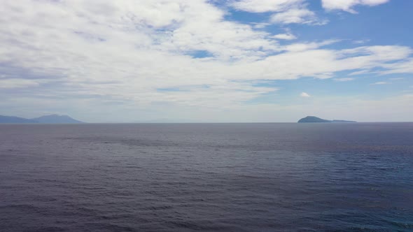 Seascape with Islands in the Distance. Blue Sea and Sky with Clouds, View From the Drone. alt