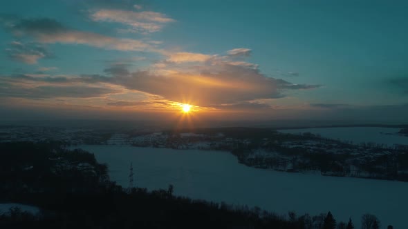 Aerial View of the Winter River at Sunset
