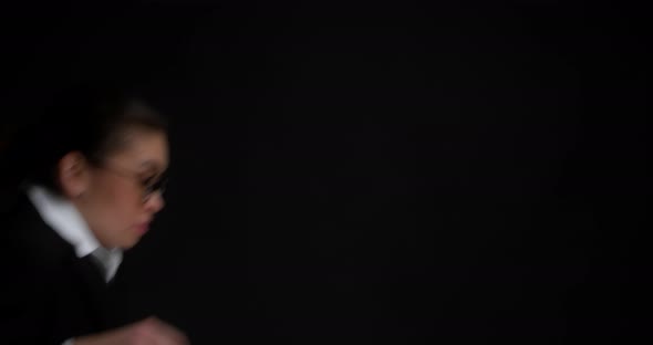 Business Woman Appears on an Background Looks Around with Her Eyes and Leaves alt