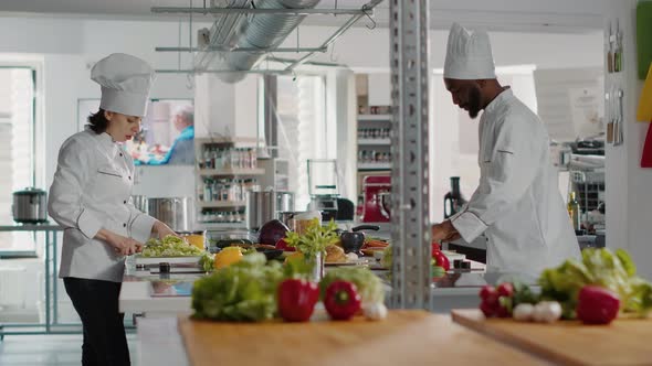 Man and Woman Cooking Organic Meal with Celery and Vegetables alt