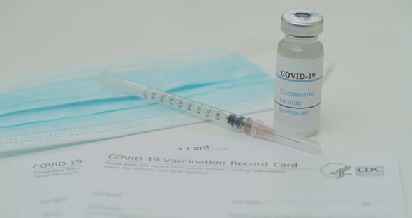 Medical Mask and COVID19 Vaccine on Vaccination Record Card Approved By CDC with Corona Virus alt