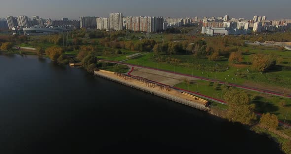 Сity pier near the water in