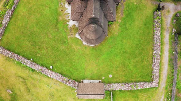 Aerial View Of The Gol Stave Church On The Lush Field In Oslo, Norway - top-down shot alt