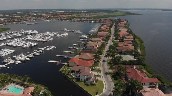 Beautiful aerial of a gated South Florida boat and home community alt