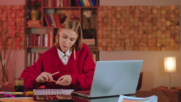 Happy Smart Lady Student Sitting on the Library alt