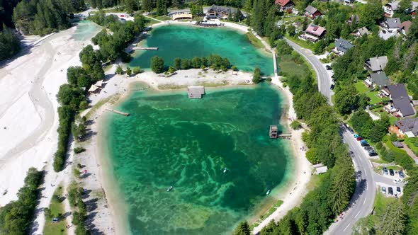 Aerial footage of a beautiful lake with turquoise water, full view of Jasna lake alt