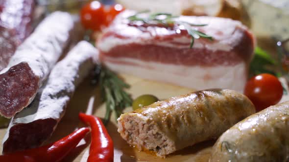 Assorted Deli Meats, Ham, Salami, Bacon and Tomatoes on the Black Stone Tray alt