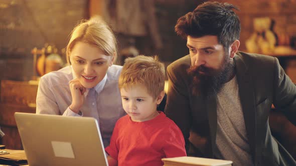 Parents with Kids Ready for School. Kid Is Learning in Class on Background of Blackboard. alt