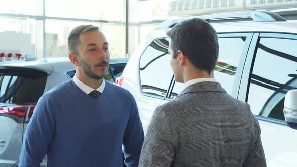 Serious Seller and Buyer Shaking Hands