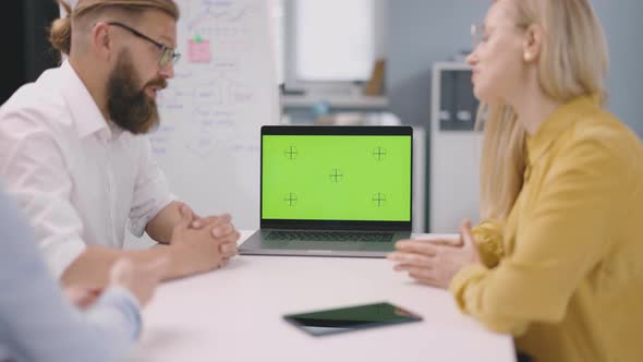 Workers Using Chroma Key Laptop alt