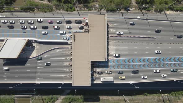 Aerial top down view Cars passing Toll gateway on Highway multi lane road. alt