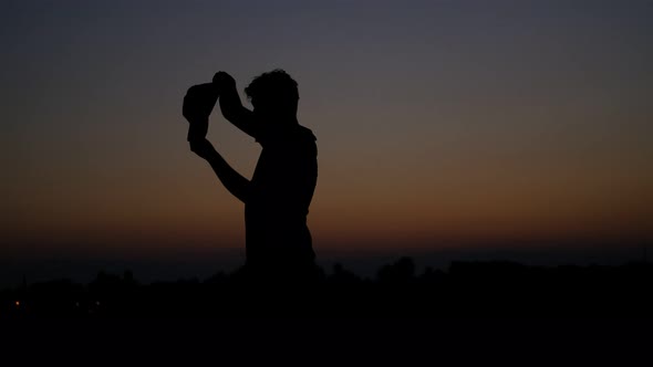 Young Silhouette Wearing Hat