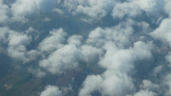 Rare White Clouds Above the Ground From the Aircraft