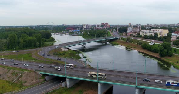 Cars Traffic Over the Bridge Across the River alt