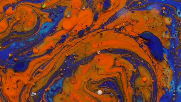 beautiful colored abstract background of moving and mixing liquid paints on water surfacered alt
