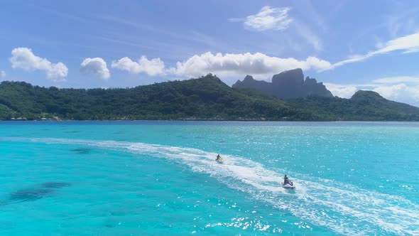 Aerial drone view of jetski personal watercraft in Bora Bora tropical island alt