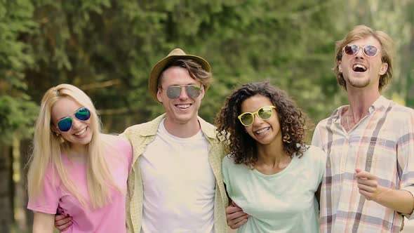 Energetic Young People Dancing and Singing in Park, Friends Having Fun Outdoors alt