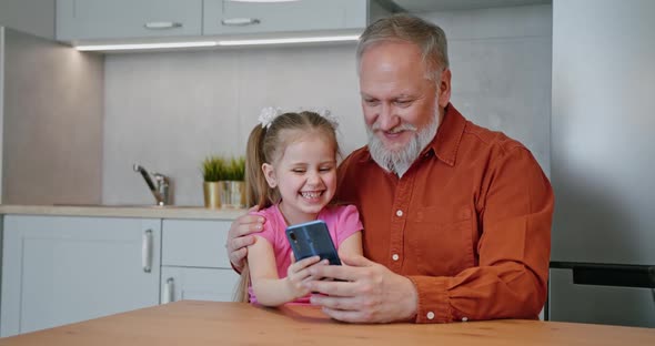 Adult Daughter Granddaughter Taking Red Gift Box to Senior Father Grandfather alt