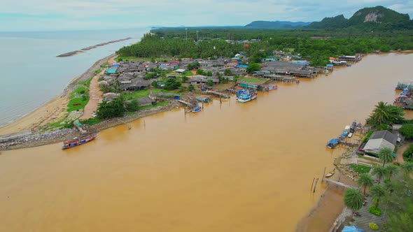 Aerial view over the river, harbor and fishing villages alt