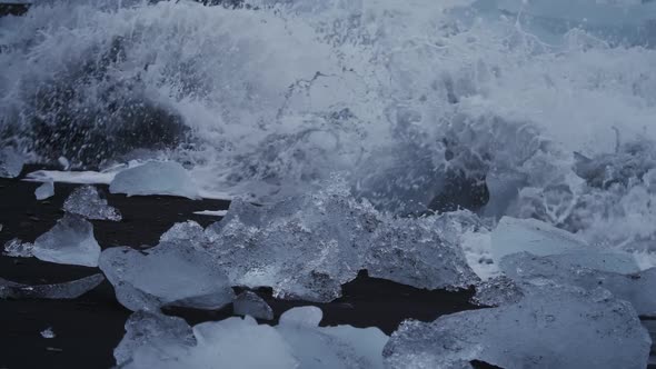 Spectacular Waves Breaking Over Icebergs on Black Sand Beach Slow Motion
