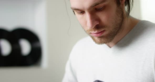 Musician Playing His Music Fingerpicking with His Fingers on the Guitar alt